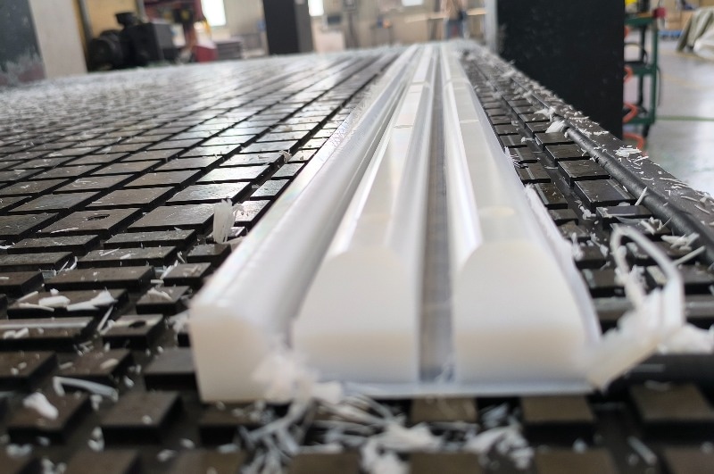 UHMWPE block showing deformation from machining with surface details and texture