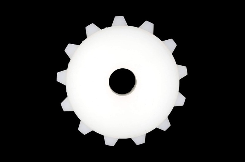 UHMWPE gears and sprockets with wear resistance on metal workbench