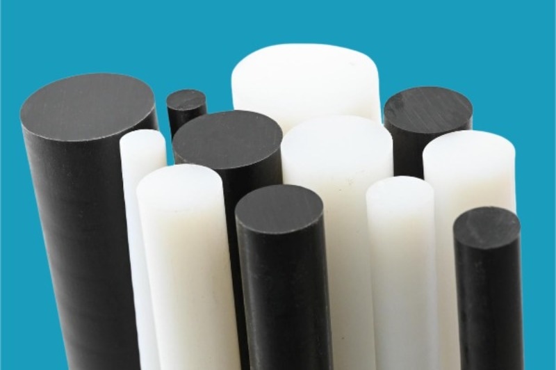 Translucent UHMW plastic rods and tubes showing flexibility and smooth finish