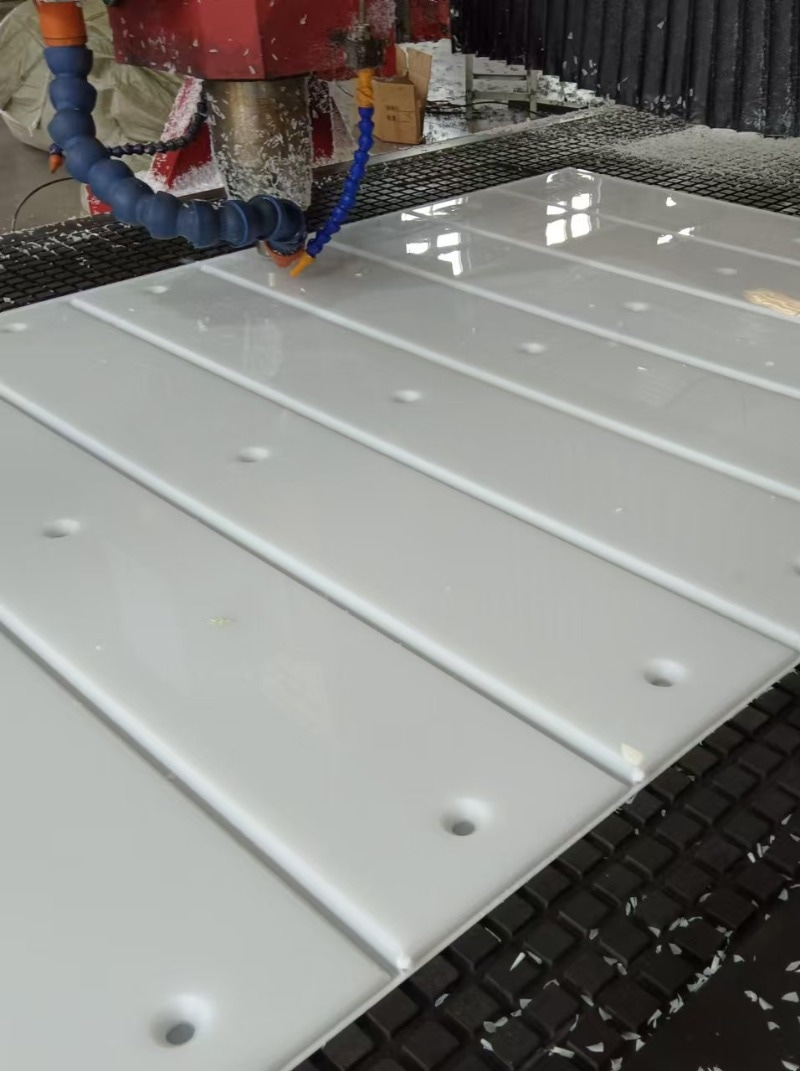 Flat machined UHMWPE piece showing no warping after cutting