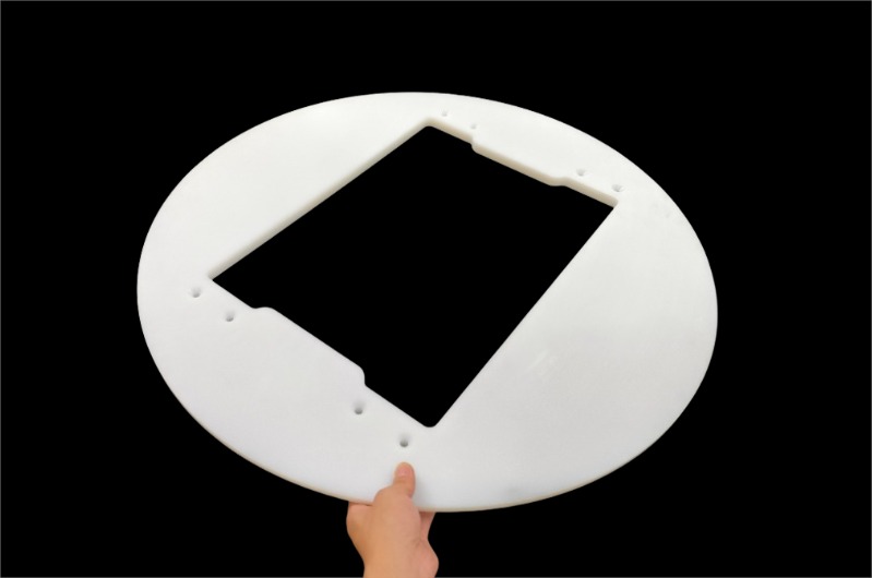 Precision-machined UHMWPE component showing smooth surface and impact durability